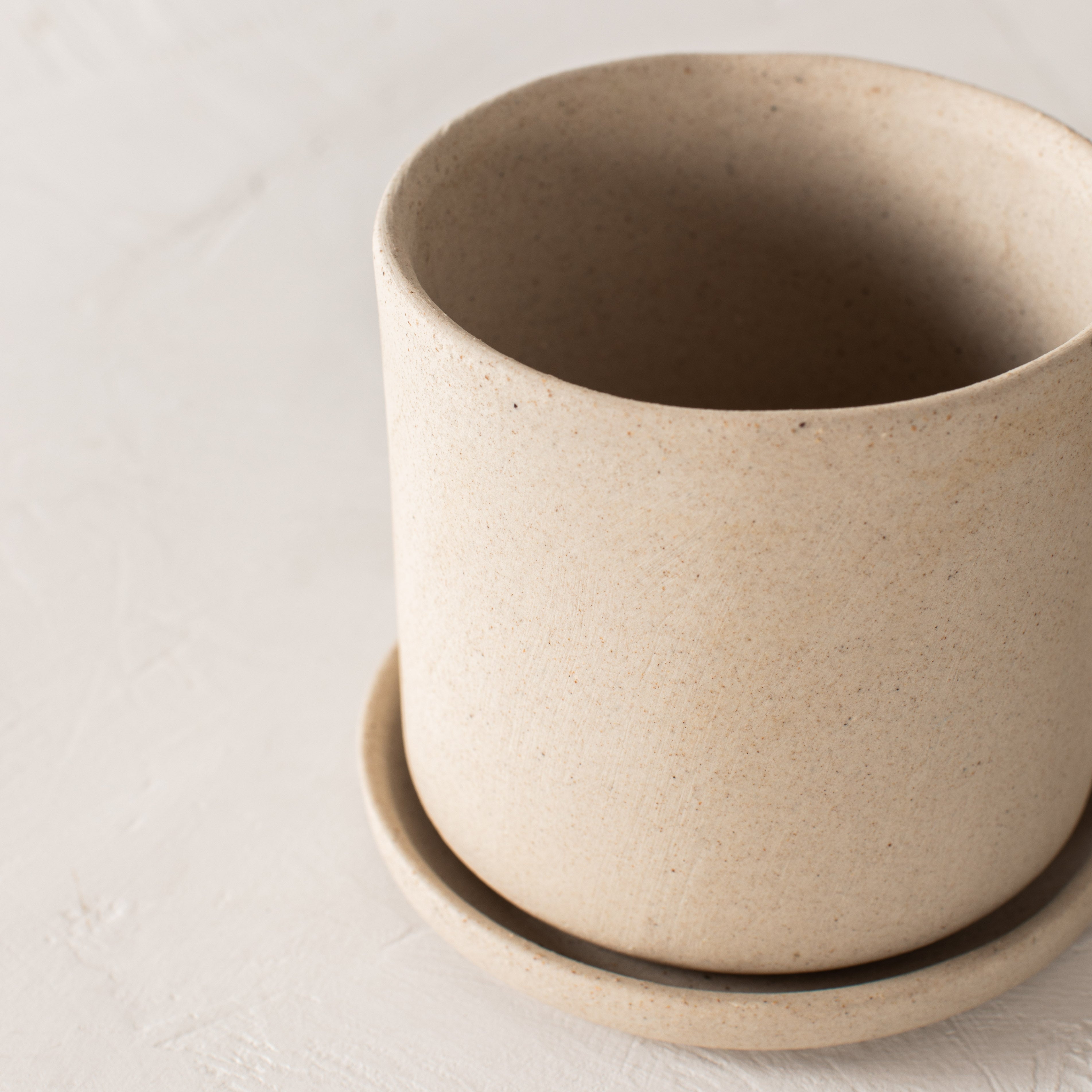 Stoneware minimal ceramic planter with bottom drainage dish. Handmade stoneware ceramic planter, designed by Convivial Production, sold by Shop Verdant Kansas City, Mo plant store.